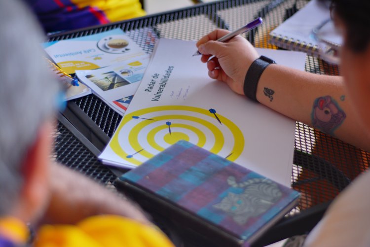 Hands on a table with educational documents